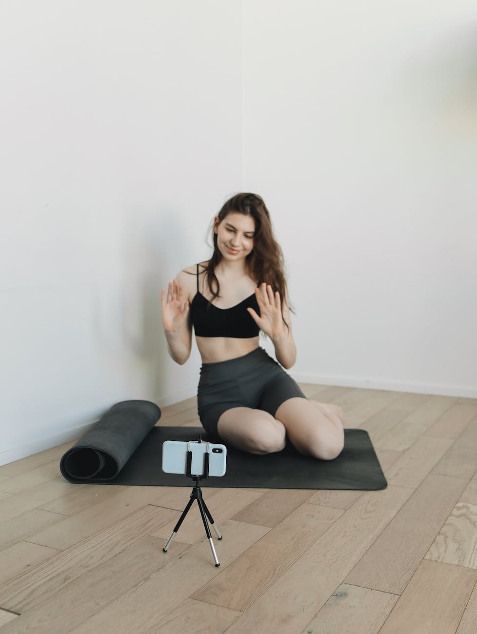 a woman recording her exercise